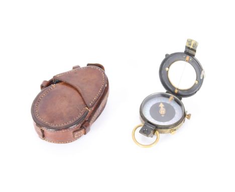 A WWI era (dated 1917) military compass with its leather case also dated 1917