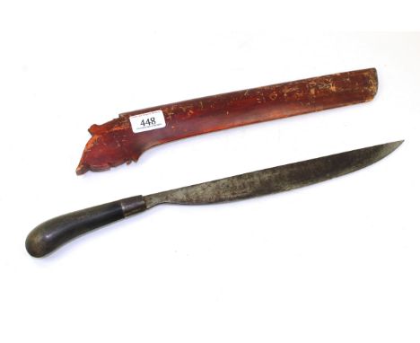 A small Barong within wooden scabbard blade 12½" in length, horn grip marked D.H. Bannister 