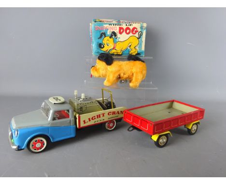 Trade Mark toys clockwork Sniffing Dog, boxed & a Chinese tinplate model 'Light Crane' tow truck & trailer (3)   Condition Re