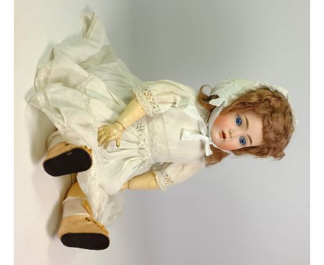 Early 20th Century Kammer & Reinhardt 'Mein Liebling' 117 N bisque head doll with blue glass eyes, open mouth and composite j