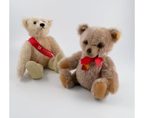 Two Steiff teddy bears, both being blonde, one wearing a sash, the other with label Brummbar, both boxed