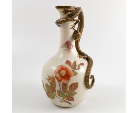 A Royal Worcester ivory jug, the handled moulded as a gilded lizard, the body decorated with flowers, dated 1885, height 8.75