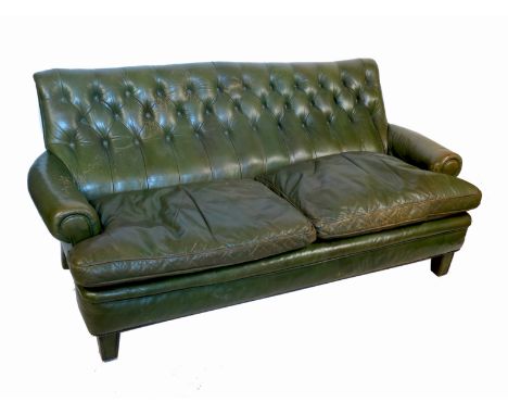 A 20th century leather sofa, with a raked back and tapering front feet, width 66ins