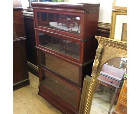 A four section mahogany Globe Wernicke bookcase, width 34ins, height 56ins Condition report: Some rubbing, wear and condition