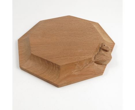 A Robert Thompson of Kilburn "Mouseman" octagonal stand, with chamfered edge and carved with a mouse, diameter 7.5ins