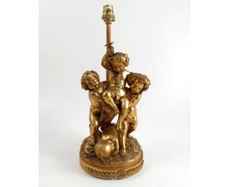 J Feuchere, gilt metal lamp base, modelled as four putti with grape vine, the base inscribed and dated 1841, height excluding