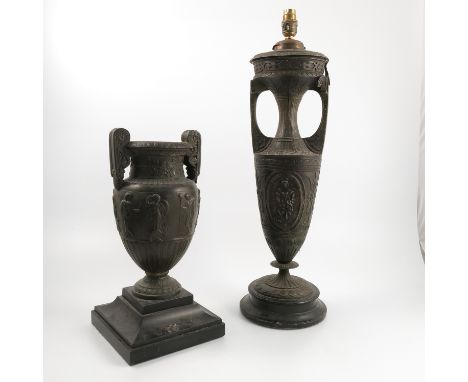 A spelter urn, of Classical form and decorated with leaves, scrolls and female figures, on a stepped square base, height 15.5