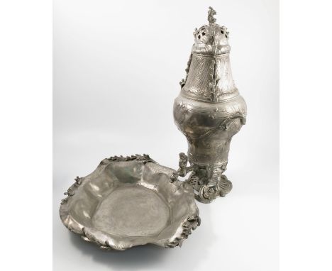 A 19th century French pewter water fountain and basin, decorated in the rococo style, the fountain with pierced lid decorated