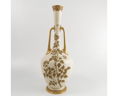 A 19th century Royal Worcester ivory vase, with slender neck, a pair of gilt handles and decorated in gilt with flowers and l