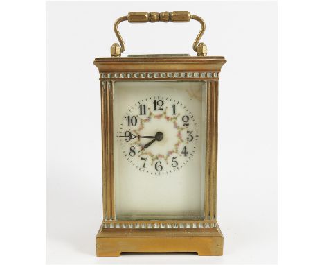 A French brass cased carriage clock, the white enamel dial with floral swags, the movement marked R & Co. Made in Paris, heig