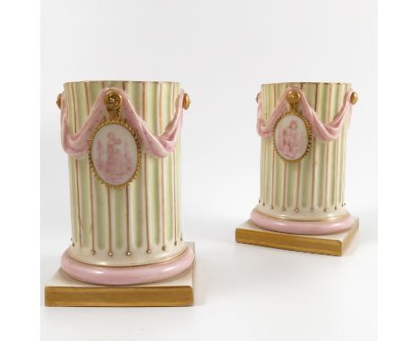A pair of 19th century Royal Worcester vases, formed as fluted columns, decorated with swags of cloth and Classically decorat