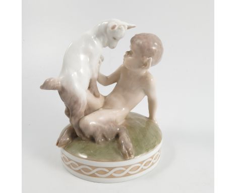 A Royal Copenhagen model, by Christian Thomsen, printed and painted as the seated figure of a young faun playing with a kid g