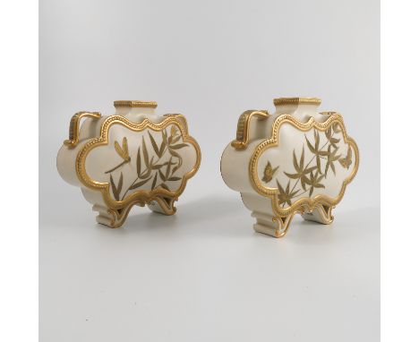 A pair of Royal Worcester vases, of shaped flat sided form, with gilded decoration of leaves and butterflies, raised on pierc