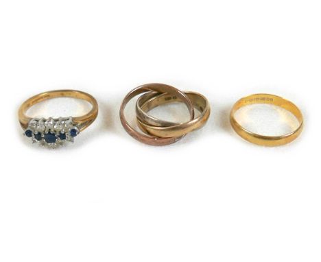 Three gold rings comprising a 9ct gold triple band tri-colour Russian wedding ring, 4.4g, size J, an 18ct gold wedding band, 
