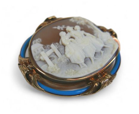 A well carved gilt metal and enamel cameo brooch, with three ladies in a countryside scene, 5.5 by 1.5 by 5cm in a fitted box