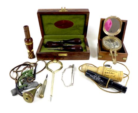 A collection of shooting / hunting items, including a Whitefront Goose Call by Ralph Grant, Gunsmith, Leicester, and a Regula