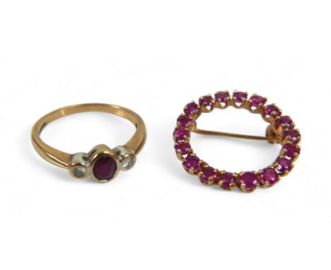 Two pieces of 9ct gold jewellery, comprising a ruby and diamond ring, the central oval cut ruby, 3 by 5mm, flanked by two sma