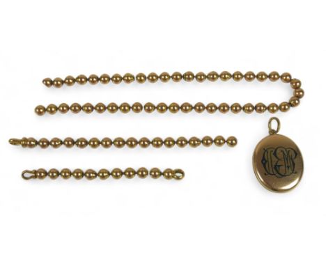 A yellow gold globe link necklace (broken) with a gilt metal locket, chain tests to 18ct on the clasp, weight 35g, length 46c