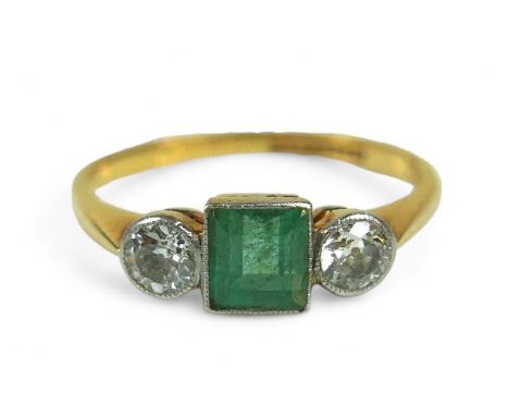 An emerald and diamond Art Deco style ring, on 9ct and platinum band, the emerald-cut central stone flanked by two brilliant 