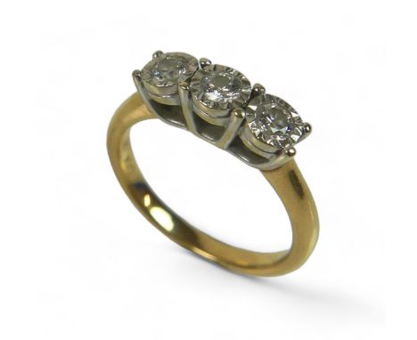A 9ct gold and three stone diamond ring, each stone brilliant cut in illusion setting, size M, 3.6g. 