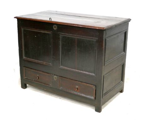 An 18th century oak mule chest, two panel front, ring hinges, raised on stile feet, 112 by 60 by 86cm high. 
