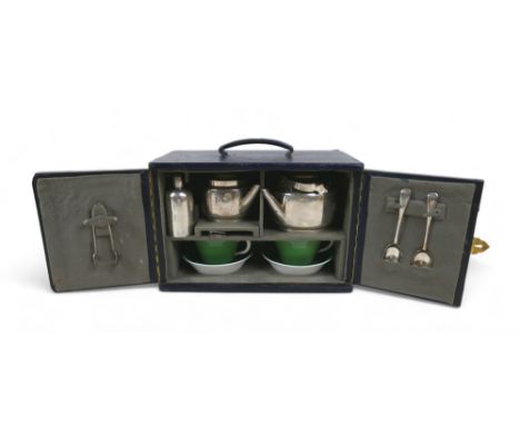 An Edwardian silver gentleman's / officer's travelling tea set, designed by Dr. Christopher Dresser, comprising a spirit burn