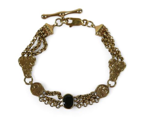 A 9ct yellow gold fancy watch chain link bracelet set with a single garnet, 20.5 by 3cm, 20.2gs. 