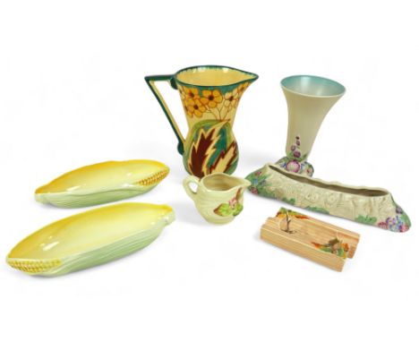 A group of mid 20th century ceramics, comprising three pieces of relief moulded Clarice Cliff, Carlton ware, Sylvac and a Pho