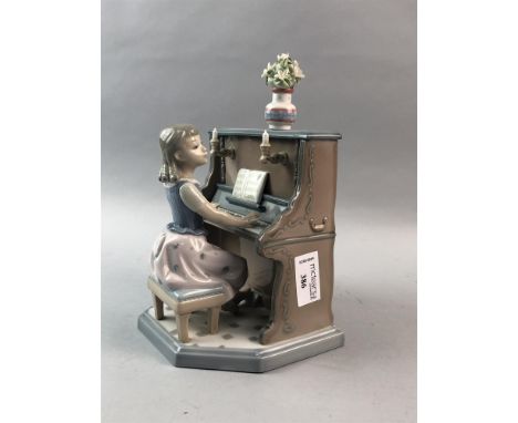 LLADRO FIGURE OF A GIRL PLAYING THE PIANO, 22.5cm high
