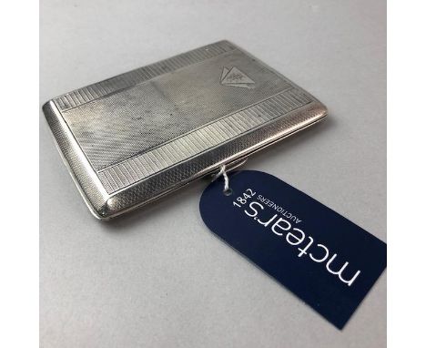 GEORGE V SILVER CIGARETTE CASE, maker E J Trevitt &amp; Sons, Chester 1932, of rectangular form, engine turned exterior, gilt
