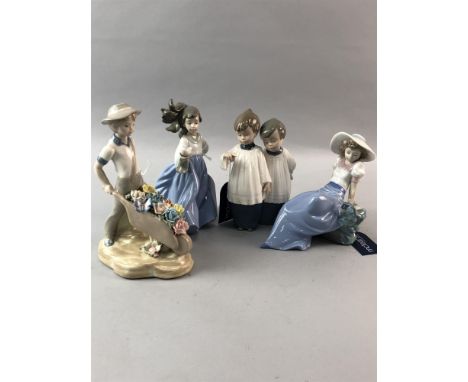 NAO FIGURE OF A GIRL HOLDING A BIRD, 19cm high, along with two other Nao figures and a Spanish figure (4)