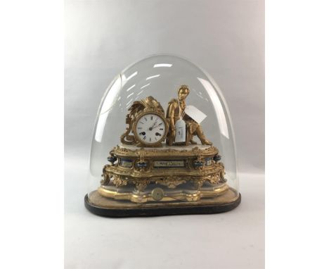 19TH CENTURY FIGURAL GILT MANTEL CLOCK, with a wood plinth and glass dome, 30cm high