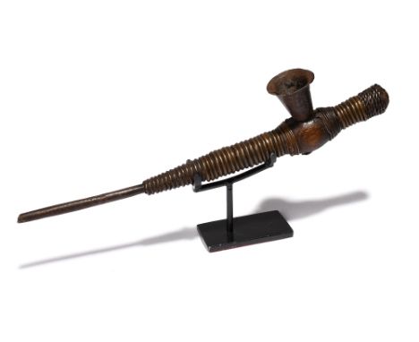 A Kota pipe Gabon with brass, copper and iron wire, the iron bowl with carved linear decoration, 23.7cm long, on a stand. (2)