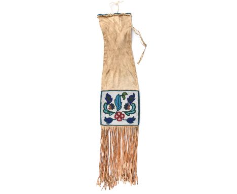 A Plains Cree or Blackfoot pipe bag Northern Plains buckskin and coloured glass beads of differing foliate panels, the beaded