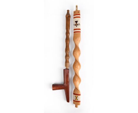 A Plains pipe with a catlinite T shape bowl having a tapered end, with a turned wood stem, 20th century, 44.5cm long and a sp