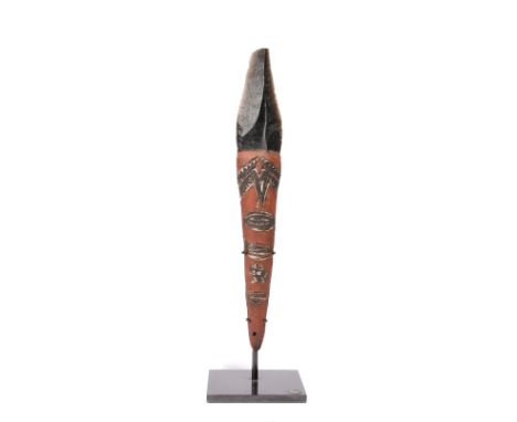 An Admiralty Islands fighting dagger Melanesia with an obsidian blade and a gum covered handle with carved symbols with ochre