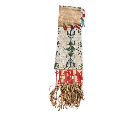A Sioux pipe bag Plains buckskin, coloured glass beads, rawhide, dyed quill, tin cones and dyed horse hair, with matching geo