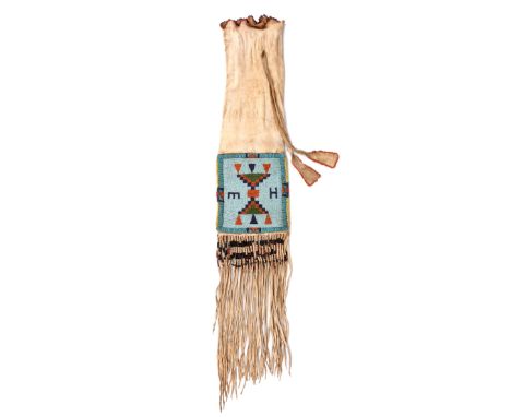 A Blackfoot pipe bag Plains buckskin and coloured glass beads, the wavy top with bead edging and with side ties having bead e