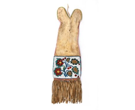 A Cree or Saulteaux pipe bag Subarctic buckskin and coloured glass beads with differing floral panels and edging, the tassele
