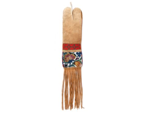 An Ojibwa or Cree pipe bag Northern Plains moosehide, cloth and coloured glass beads, with beaded edging and a strip panel ab