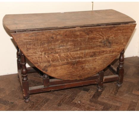Antique oak oval gate leg dining table on turned legs approx 5'4 x 4'2 with leaves up 