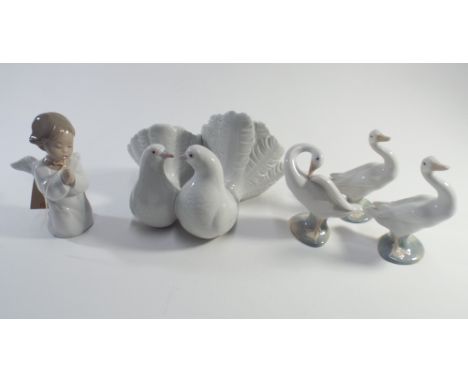 Five pieces of Lladro porcelain to include praying cherub and a pair of lovebirds.  All good except one duck has chipped bill