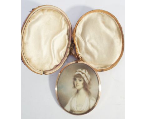Early 19th century gold framed portrait miniature on ivory depicting a lady with a bonnet with woven hair inset to the back, 