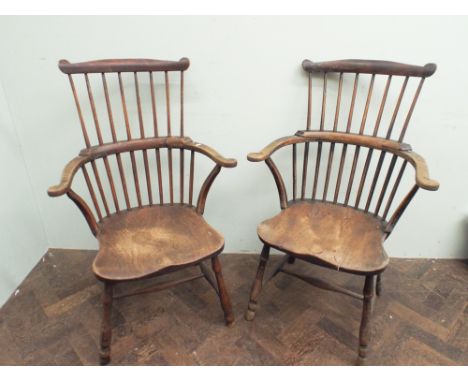 Pair of rounded stick back elm Windsor arm chairs 