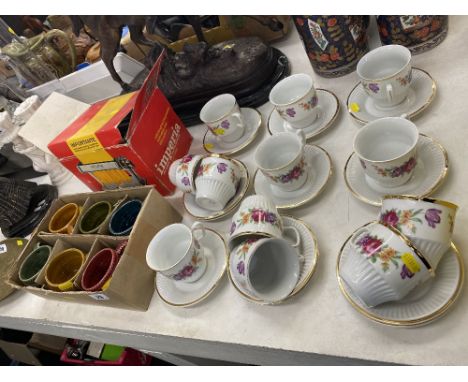 A pasta machine, six mugs and a qty of cups and saucers