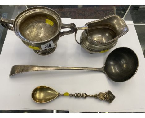 A hallmarked silver two  handled pot, sauce boat and ladle