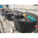 A Group of (4) 550 Gallon Poly Holding Tanks