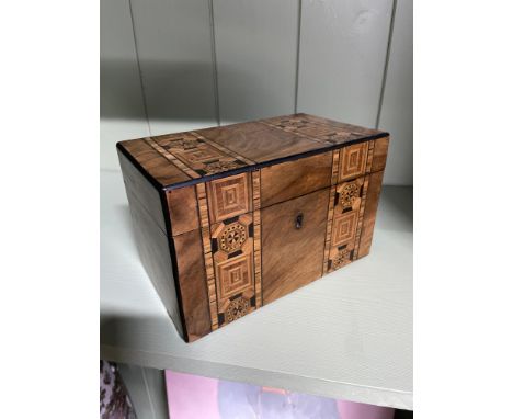 A Victorian Mahogany marquetry inlaid tea caddy. Includes two interior lids. 