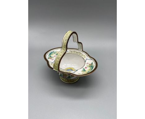 A 19th century Chinese hand painted enamel on copper basket. Designed with various foliage and yellow trims. 