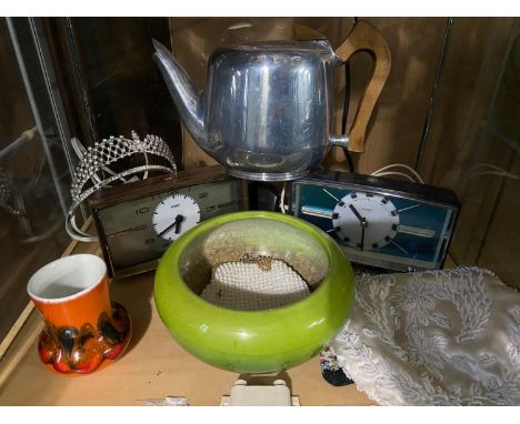 A Shelf of collectable odds to include two Metamec alarm clocks, Poole pottery vase, various beaded purses and green bowl 